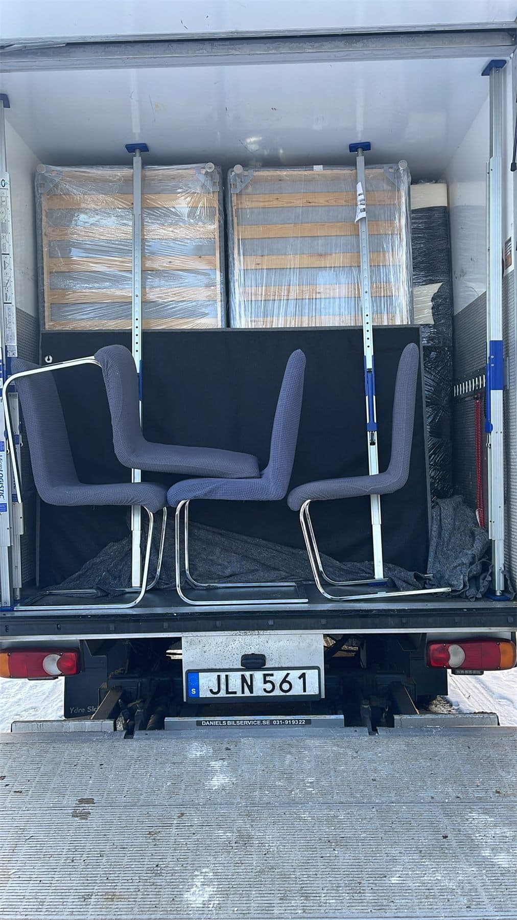 Office furniture protected and loaded for relocation